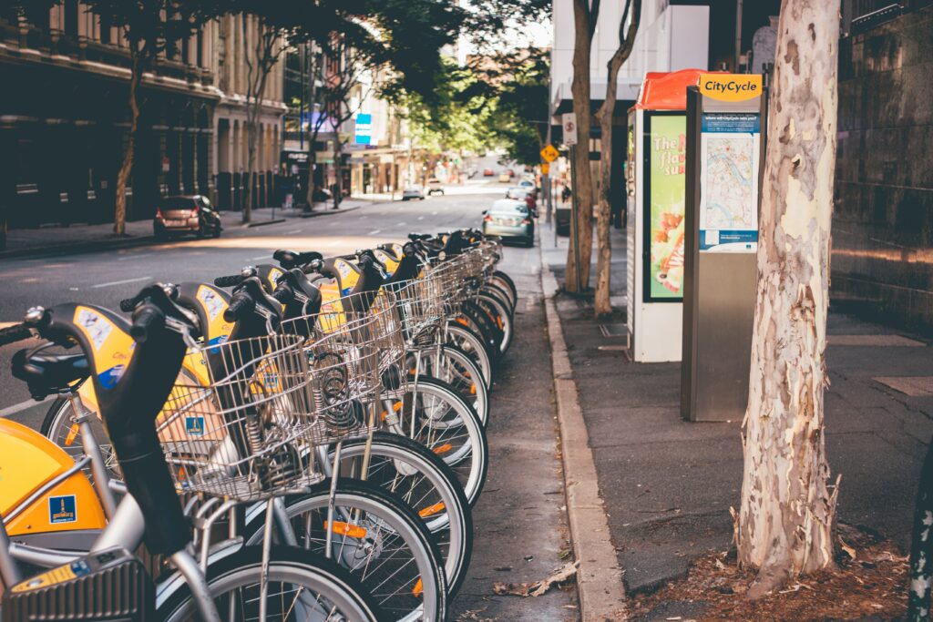 row of hire bikes lined up in a european city