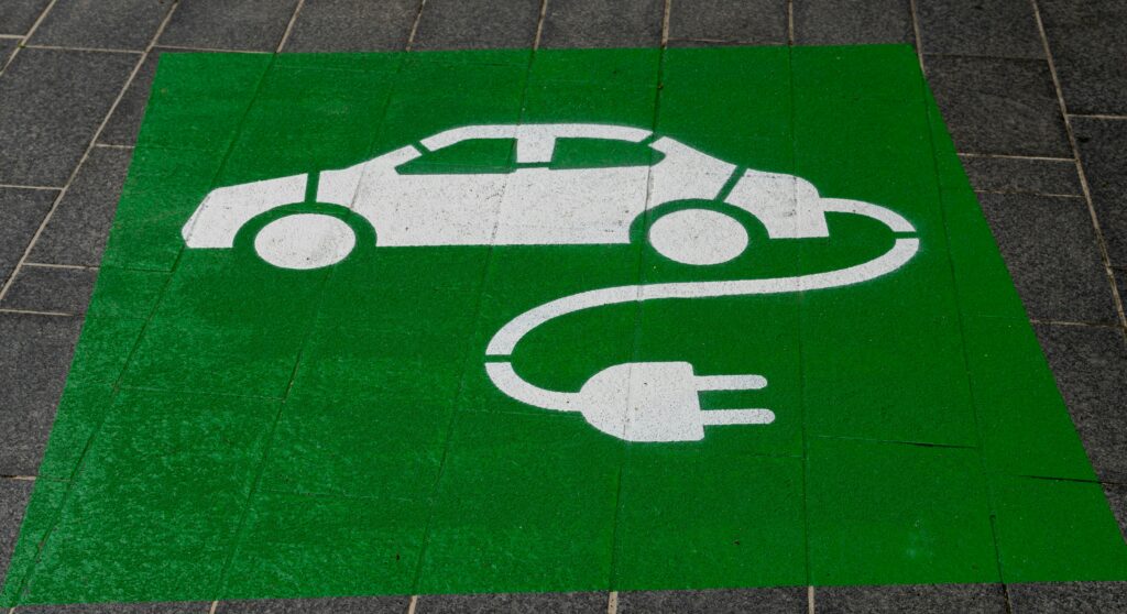 green sign for electric vehicle charging point