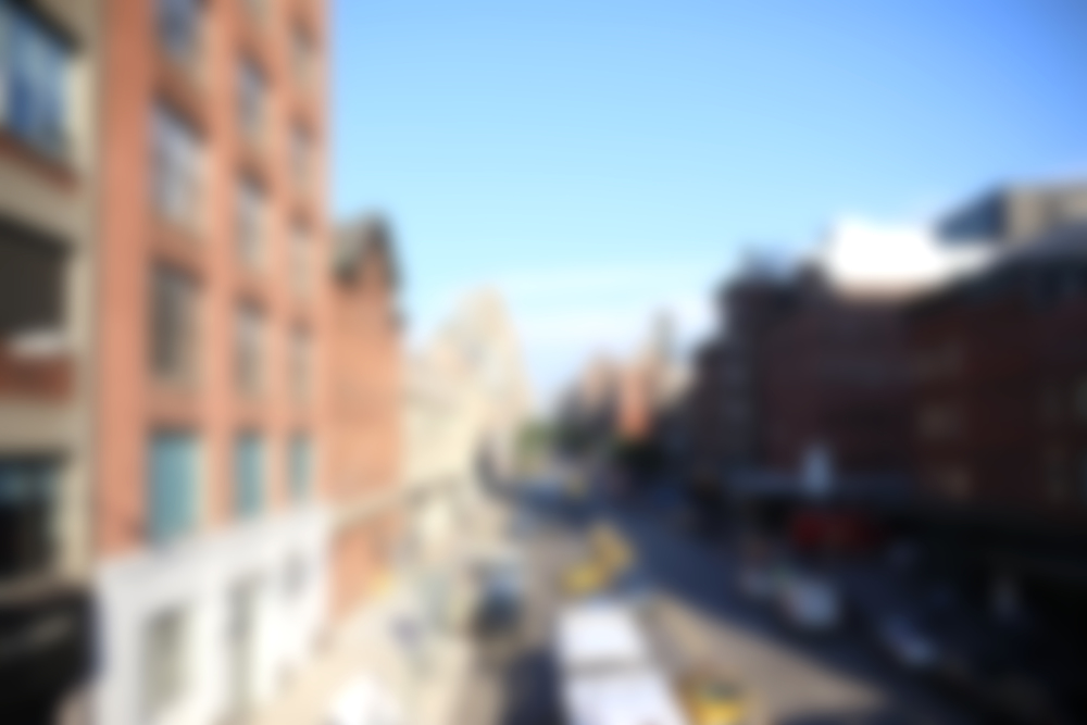 blurred image of street and office block