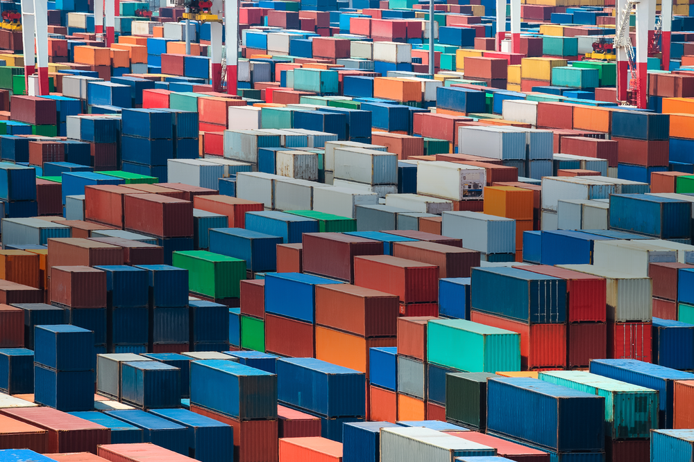 piles of oblong and cube shaped colourful metal containers