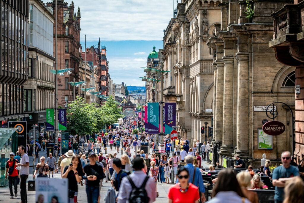 crowded glasgow city centre shopping street