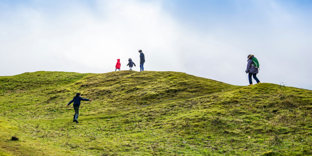 people walking through countryside 