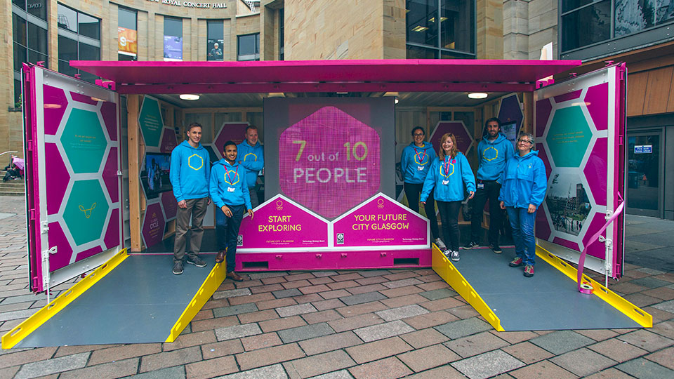 promo stand with staff promoting Open Glasgow 