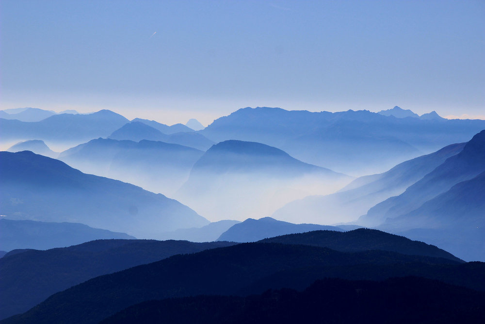 hazy mountain scene in blue shades and tones