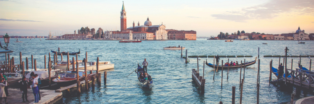 People using boats on open water in venice 